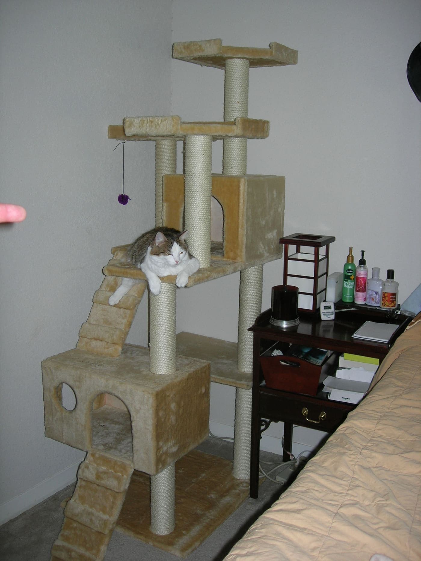 A homemade cat tree standing on the floor